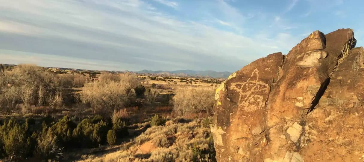 A large rock in the middle of The Chi Center with ancient drawings