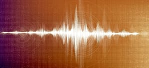 A vivid digital illustration of a white sound wave pulsing along a radiant orange and red gradient background, overlaid with a detailed grid and concentric circles, representing audio frequency and dynamics.