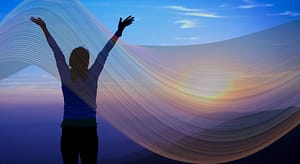 Abstract energy wave flowing over a tranquil mountain landscape at sunset, blending soft pastel colors and curved light patterns—symbolizing harmony, frequency healing, and the connection between nature and energy.