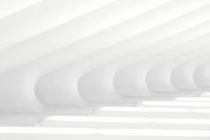 Minimalistic architectural design with curved white beams creating a clean and futuristic pattern, bathed in soft natural light.