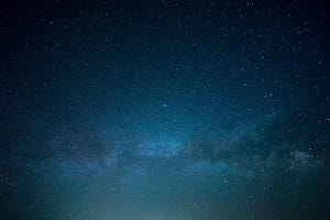 Stunning night sky filled with countless stars and the Milky Way, evoking a sense of wonder and connection to the universe.