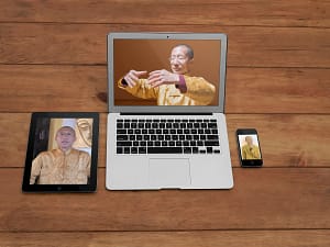 Master Mingtong Gu teaching Qigong on multiple devices—tablet, laptop, and phone—offering a 7 Weeks of Sound Healing focus and Qigong practice