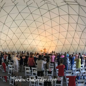 Master Mingtong Gu practicing Qigiong with members at the Chi Center Dome.